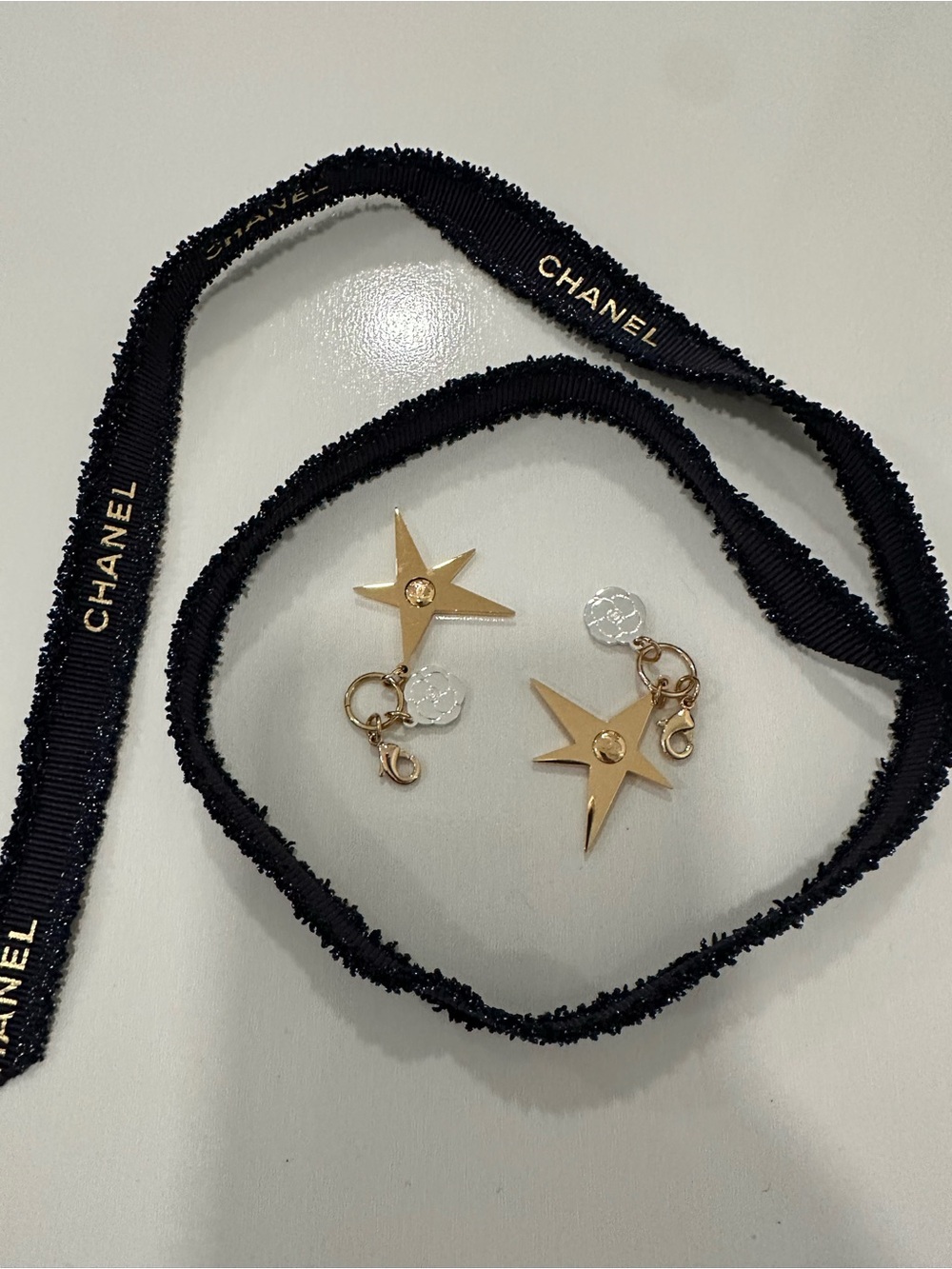 CHANEL Gold Star Charm Earrings with Logo Accent